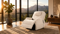 White recliner chair in a room with large windows showing mountains.
